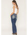 Image #1 - Miss Me Women's Medium Wash Mid Rise Fleur De Lis Pocket 30" Bootcut Stretch Denim Jeans, Medium Wash, hi-res